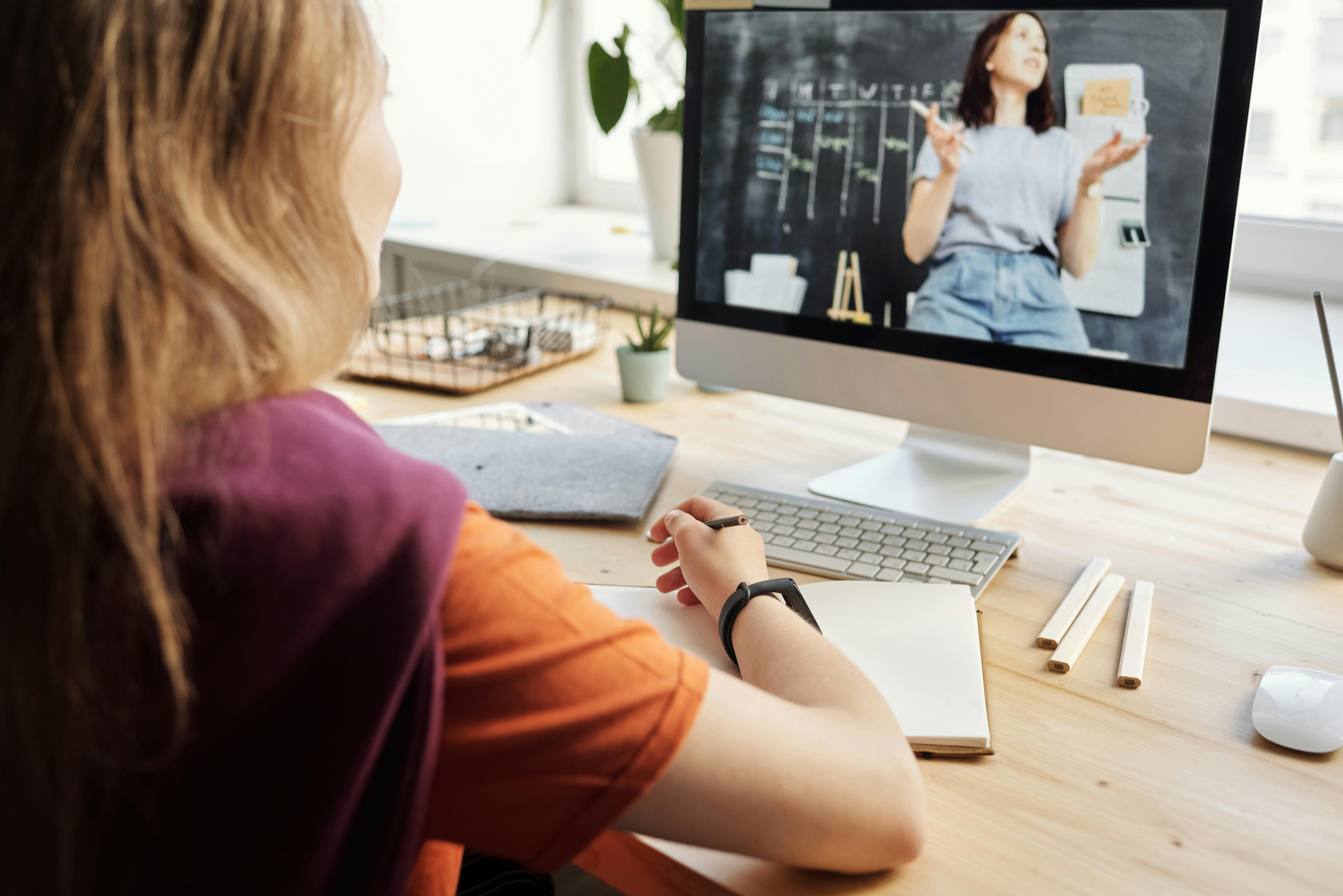 Student using an AI tool while watching online lectures